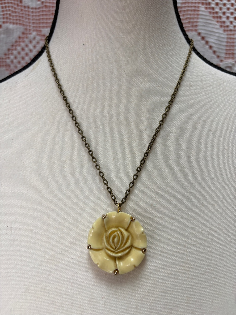 Vintage carved resin rose pendant necklace with antiqued brass tone chain